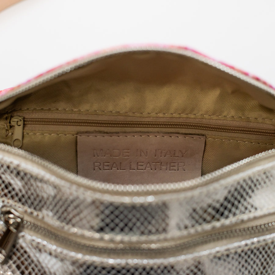 Interior image of Ava crossbody bag in Electric Kiss featuring interior zippered pocket and made in Italy real leather tag