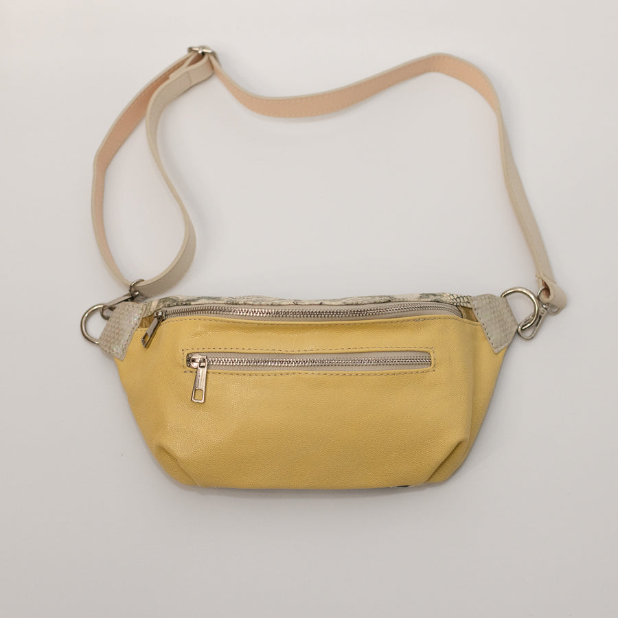 Full image of Ava crossbody bag in Aureate featuring adjustable strap and silver hardware