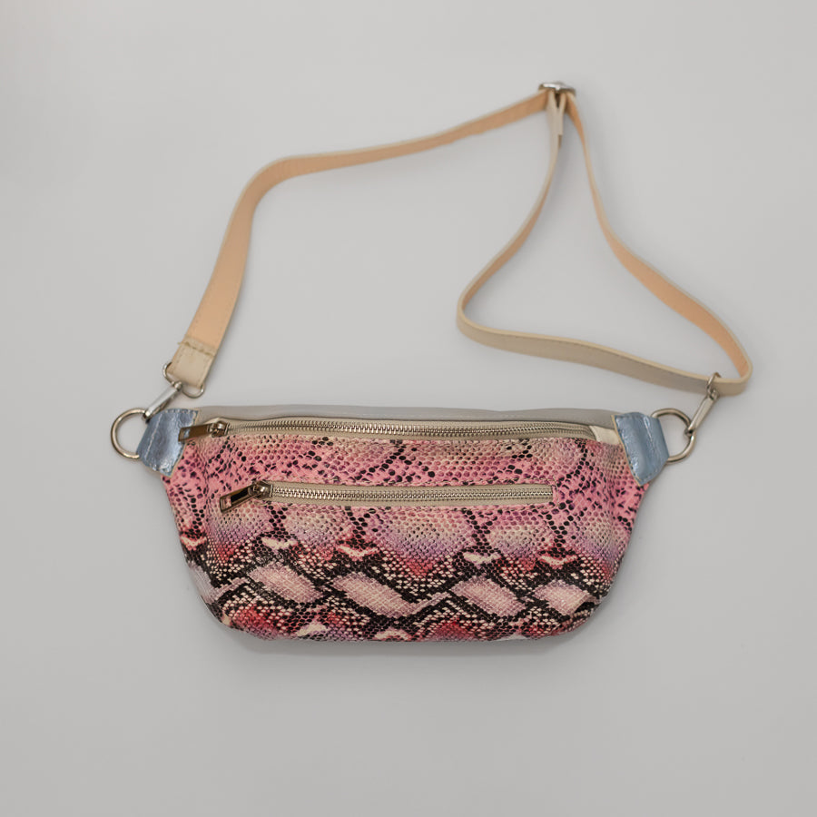 Full image of Ava crossbody bag in Pink Martini featuring pink snakeskin Italian leather and adjustable leather strap