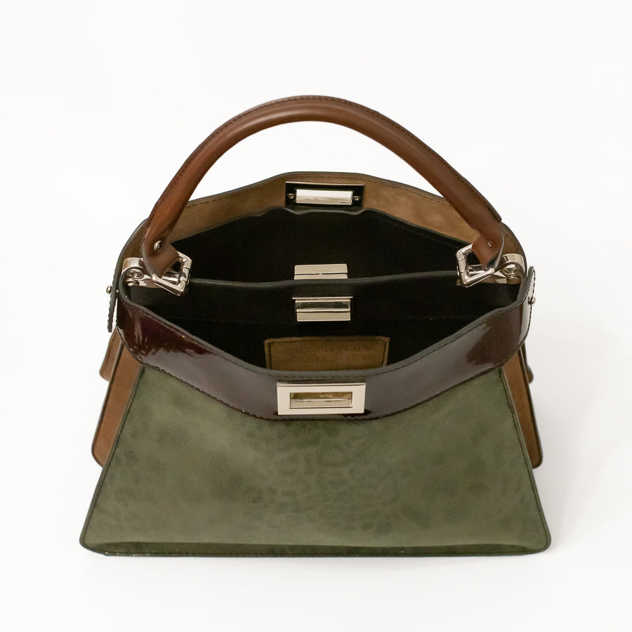 Interior image of Charlotte handbag in Olive Grove featuring dual structured components and opened turn-lock clasp