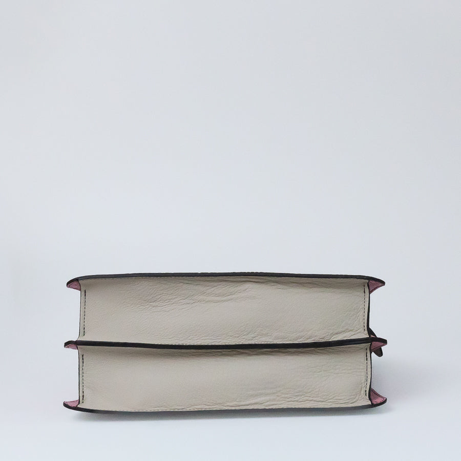 Bottom image of Charlotte handbag in Bianca Rosa featuring white Italian leather