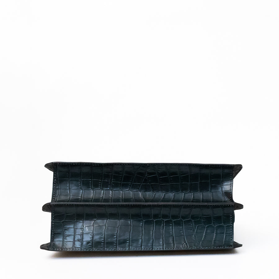 Bottom image of Charlotte handbag in Afterglow featuring black reptilian printed Italian leather