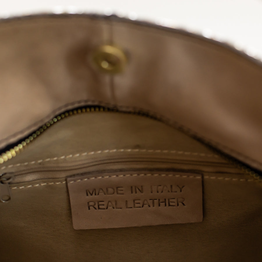 Interior image of Lily handbag in Lunaria featuring zipped interior pocket and made in Italy real leather tag