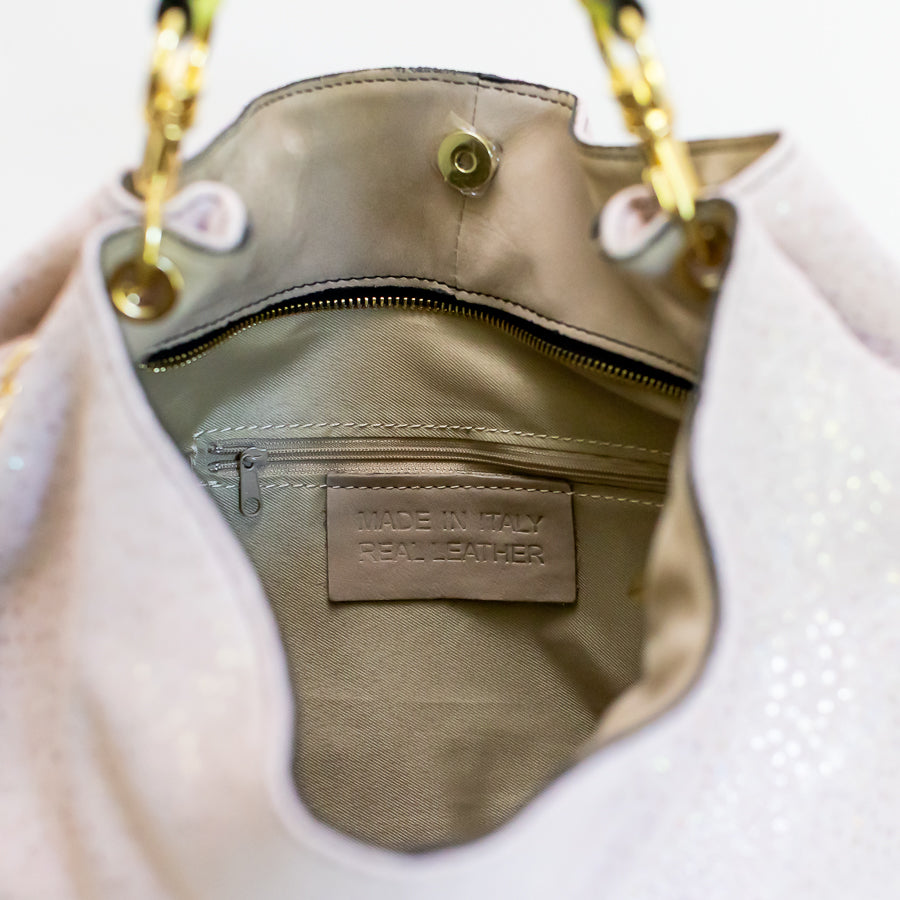 Interior image of Lily handbag Starlight featuring interior zipped pocket and made in Italy real leather tag
