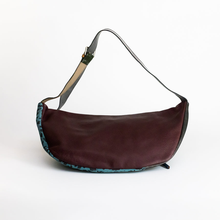 Back view of Madeline crossbody bag in Laguna Felina featuring brown Italian leather and adjustable strap
