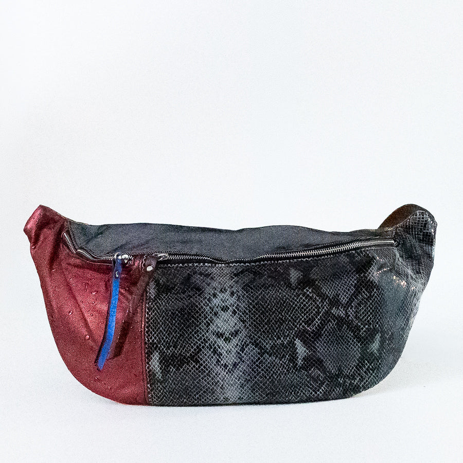 Standing view of Madeline crossbody bag in Capri Nights featuring both zippered compartments and silver hardware
