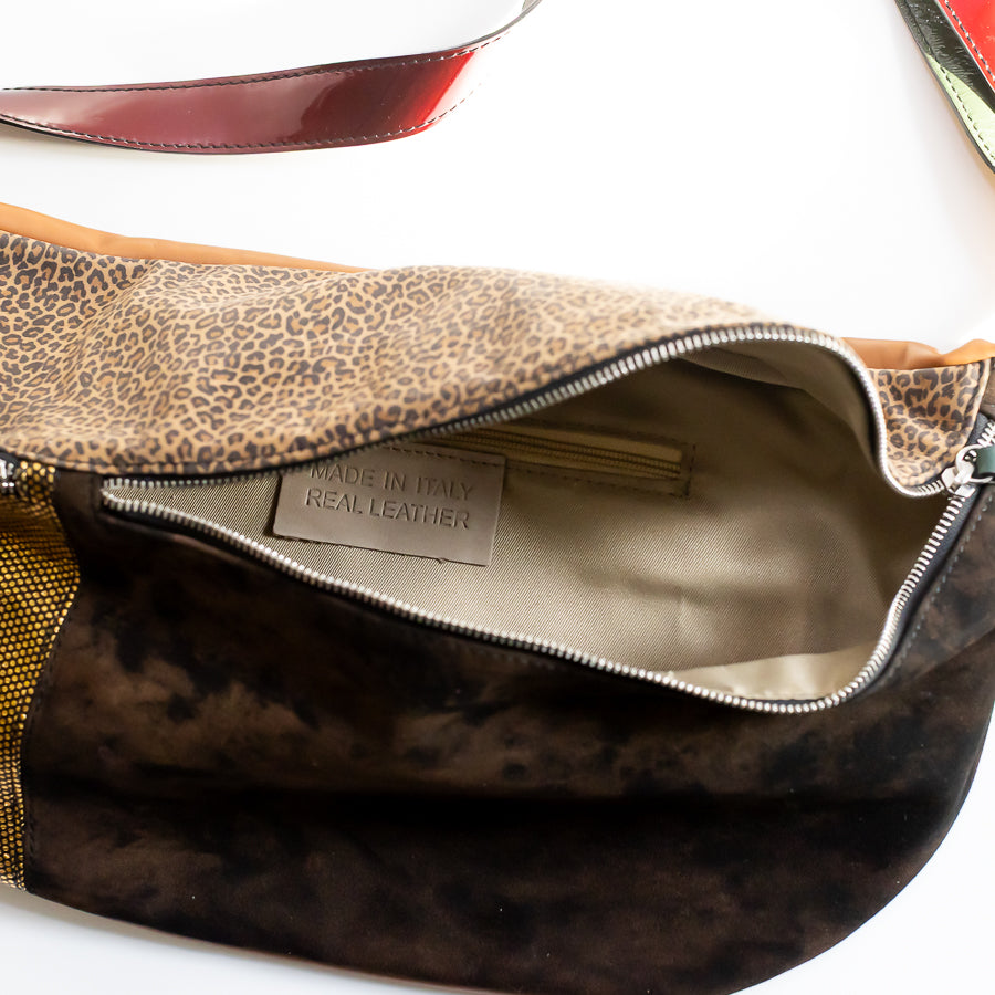 Interior view of Madeline crossbody bag in Noir Jardin featuring interior zipped pocket and made in Italy real leather tag
