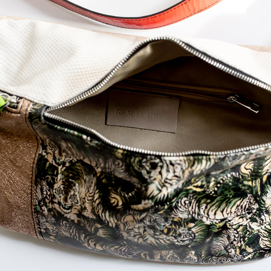 Interior view of Madeline crossbody bad in Midnight Bazaar featuring interior zippered pocket and made in Italy real leather tag