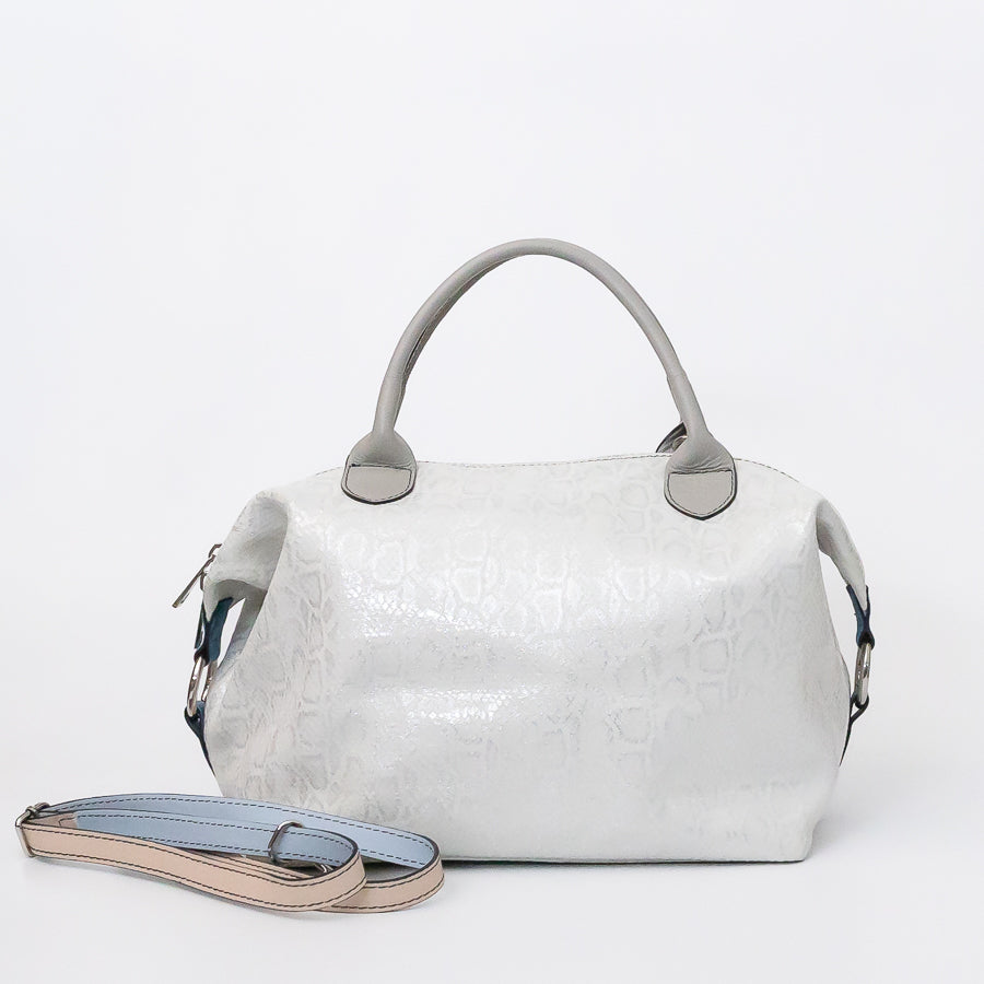 Vera handbag in Winter Lace featuring side straps with silver o-ring clasp and top handles and extra strap