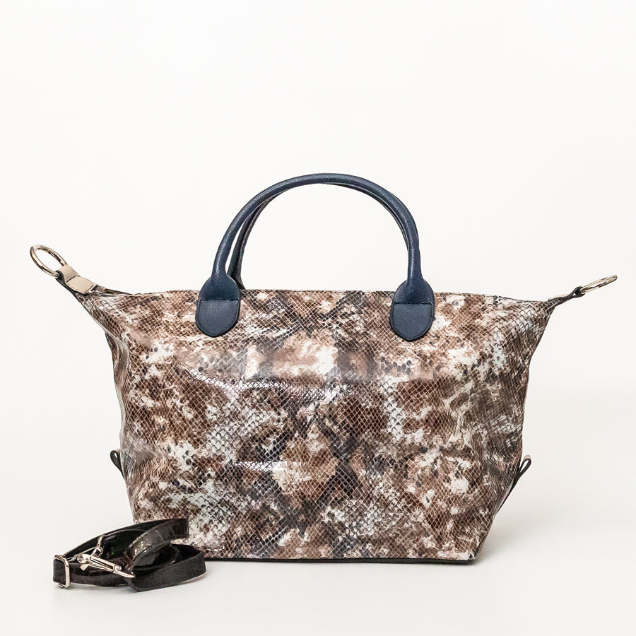 Expanded Vera handbag in Desert Sands featuring blue structured top handles and snakeskin Italian leather