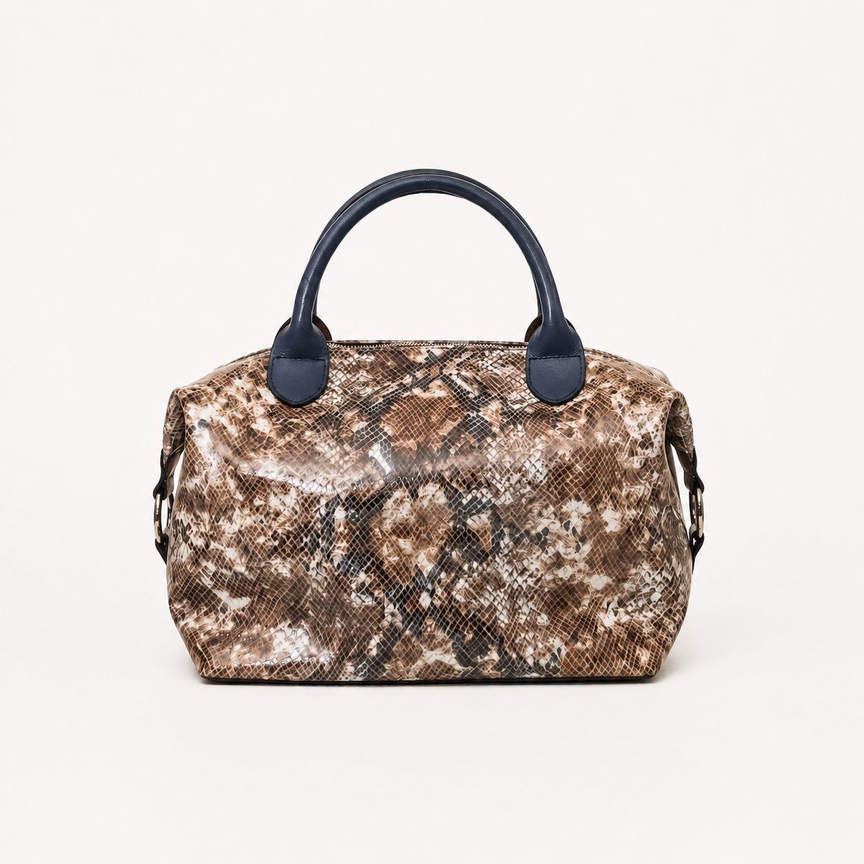 Vera handbag in Desert Sands featuring side straps with silver o-ring clasp and structured top handles
