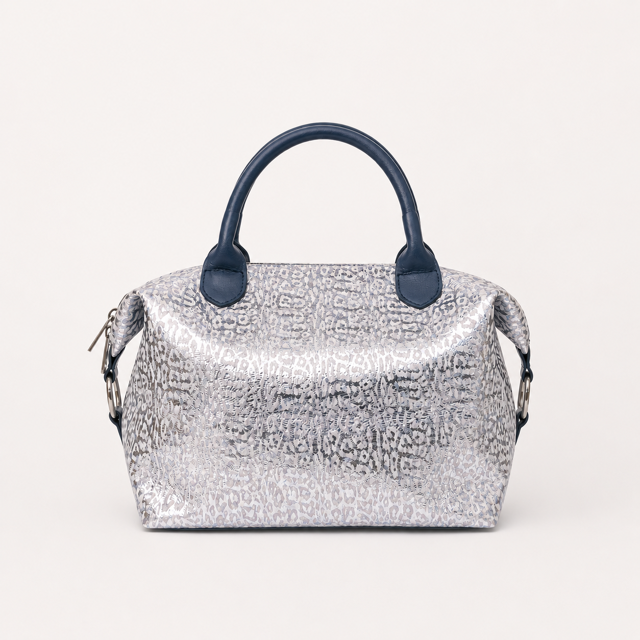 Vera silver handbag in Moonlit Riviera featuring side straps with silver o-ring clasp and structured top dark blue handles