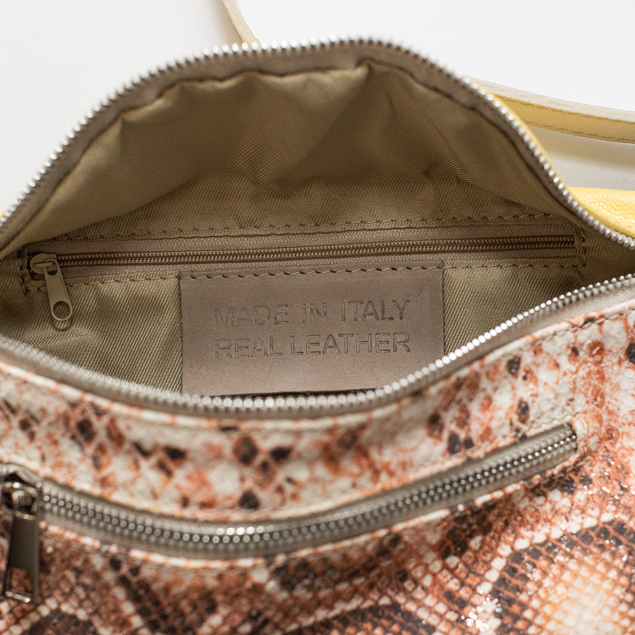 Interior image of Ava crossbody bag in Tuscan Honey featuring zippered interior pocket and made in Italy real leather tag