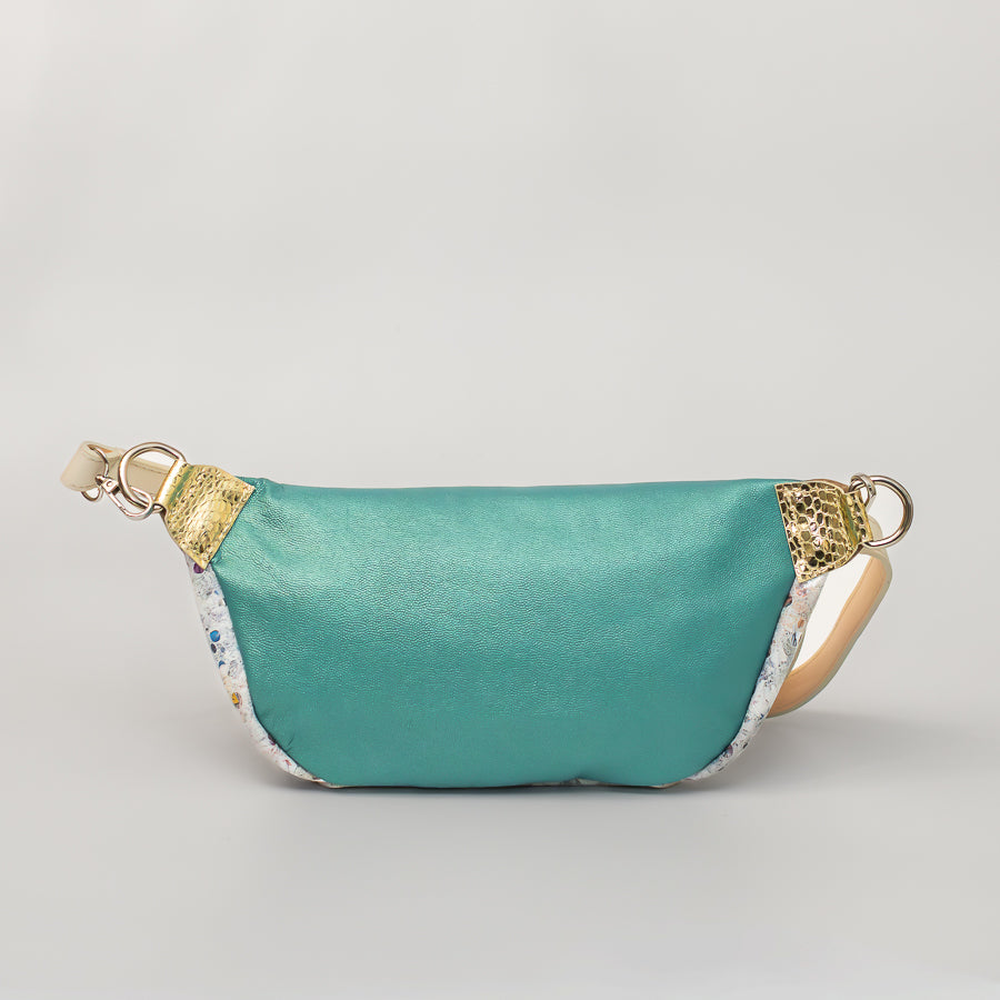 Back image of Ava crossbody bag in Jubilee featuring teal iridescent Italian leather and silver o-ring hardware