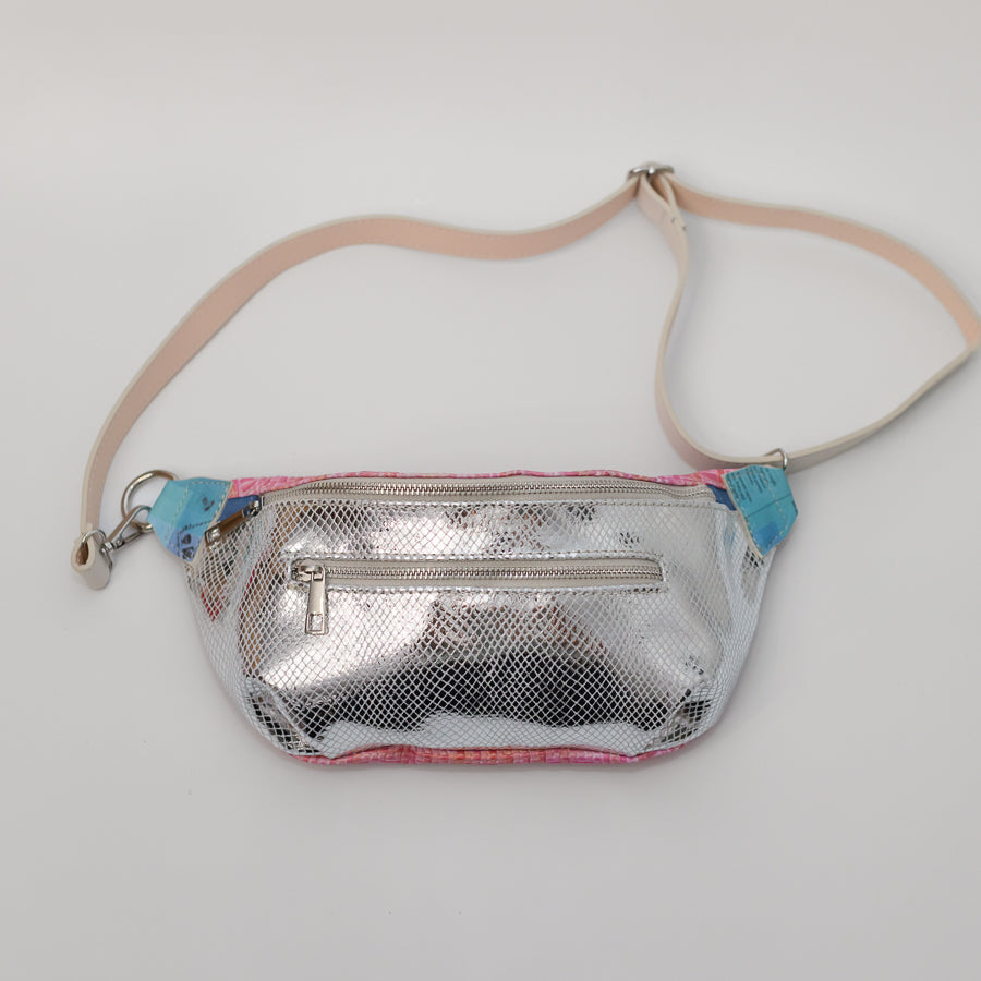 Full image of Ava crossbody bag in Electric Kiss featuring adjustable strap and silver hardware and silver iridescent Italian leather
