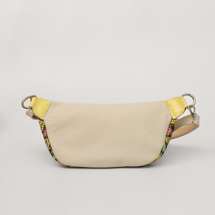 Back image of Ava crossbody bag in Carnivale featuring beige Italian leather and silver o-ring hardware