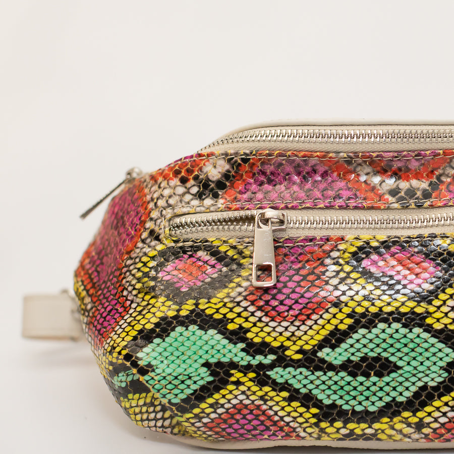 Close-up image of Ava crossbody bag in Carnivale featuring silver zipper hardware and multicolored textured Italian leather