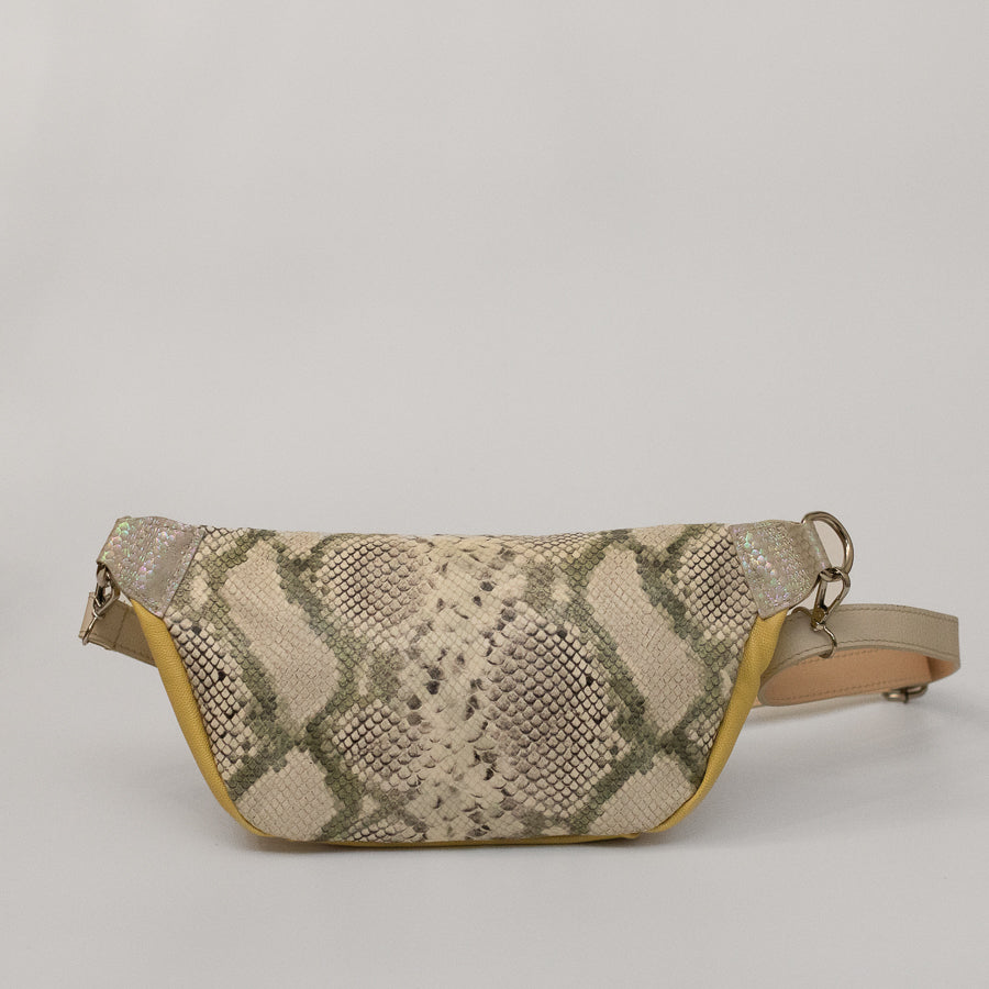 Back image of Ava crossbody bag in Aureate featuring snakeskin Italian leather and silver o-ring hardware