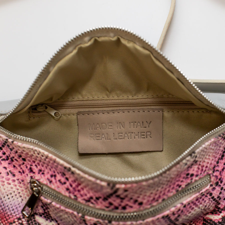 Interior image of Ava crossbody bag in Pink Martini featuring interior zippered pocket and made in Italy real leather tag