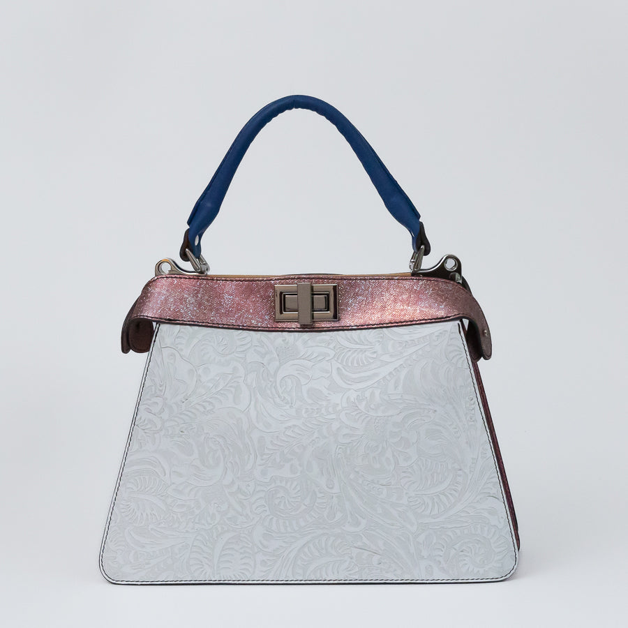Charlotte handbag in Bianca Rosa featuring carved white Italian leather with pink accent trim and blue structured top handle