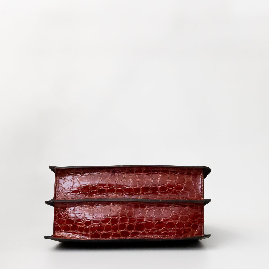 Bottom view of Charlotte handbag in Azzurra featuring textured red Italian leather