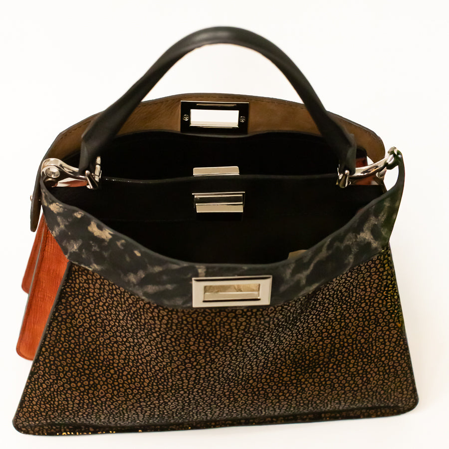 Interior view of Charlotte handbag in Tuscan Bronze featuring dual structured compartments 