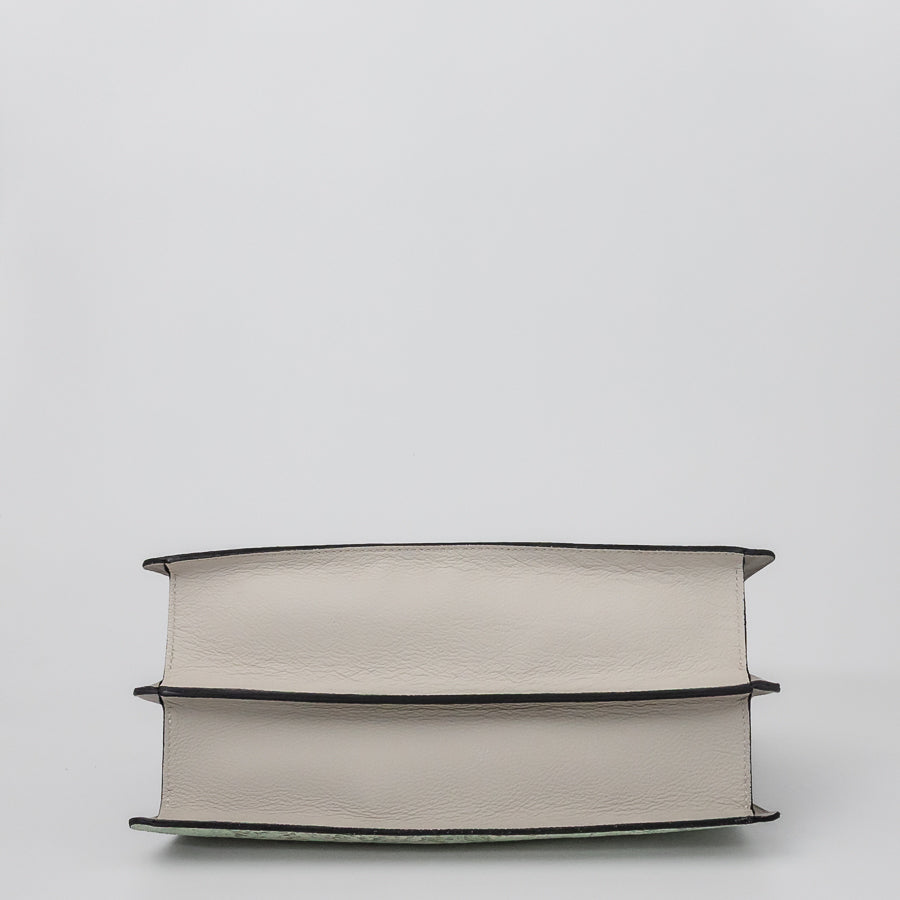 Bottom image of Charlotte handbag in Sea Glass featuring white Italian leather
