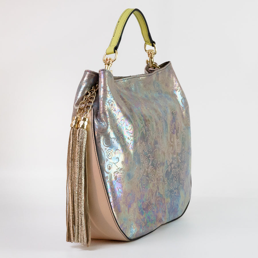 Side view of Lily handbag in Moon Garden featuring green handle and shimmering bronze tassel
