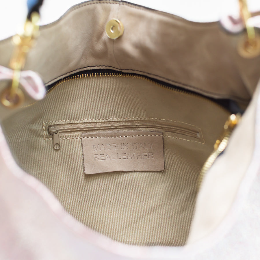 Interior close-up of Lily Moonstone handbag featuring gold zipper and smaller zippered pocket