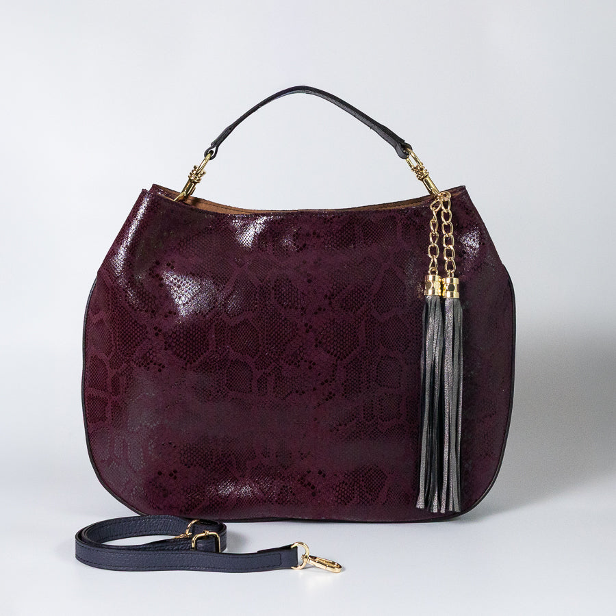 Lily handbag in Midnight Fid handcrafted in Italy featuring iridescent Italian snakeskin leather and tassel detail