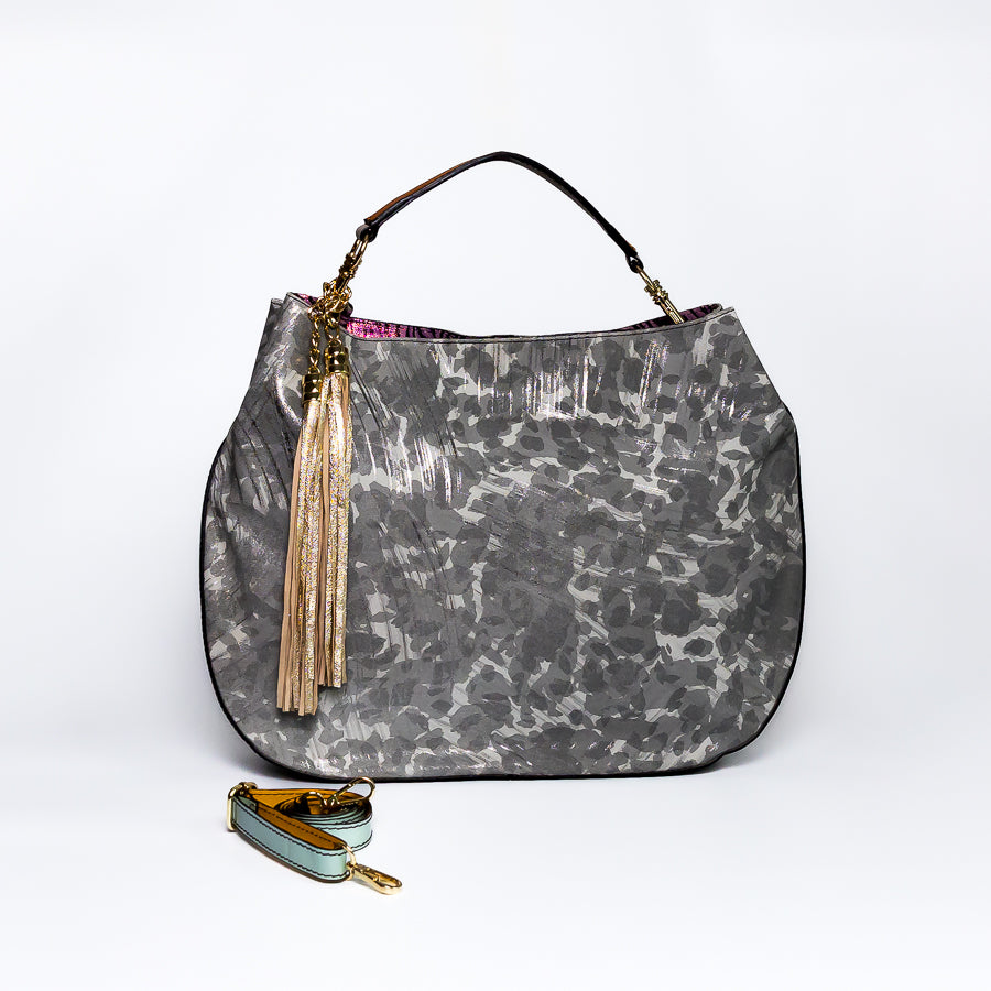 Lily handbag in Petal Kiss handcrafted in Italy featuring iridescent Italian leather and tassel detail