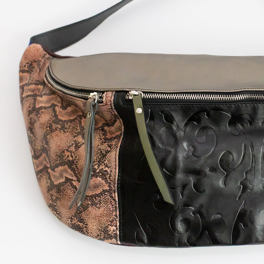 lose-up image of Madeline crossbody bad in Monaco Jungle featuring snakeskin Italian leather and green leather zippers