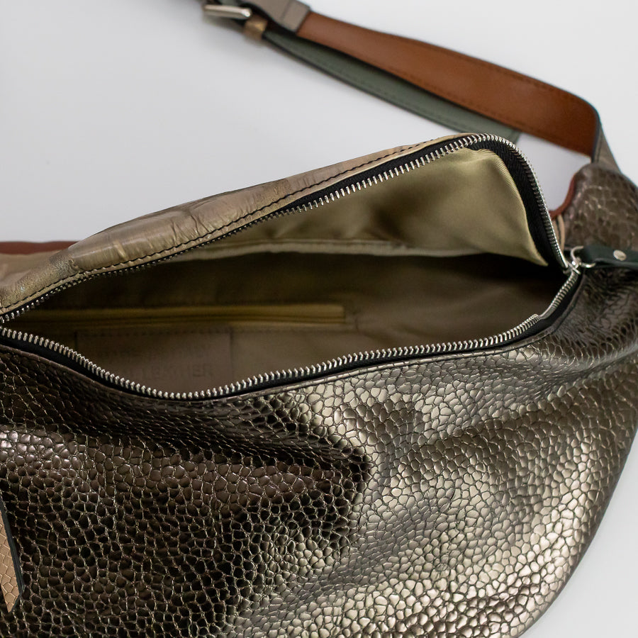 Interior view of Madeline crossbody bag in Sahara featuring interior zipped pocket and silver zipper