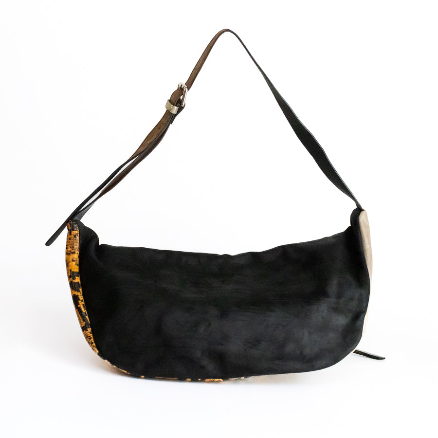 Back view of Madeline crossbody bag in Ambra featuring black Italian leather and adjustable strap