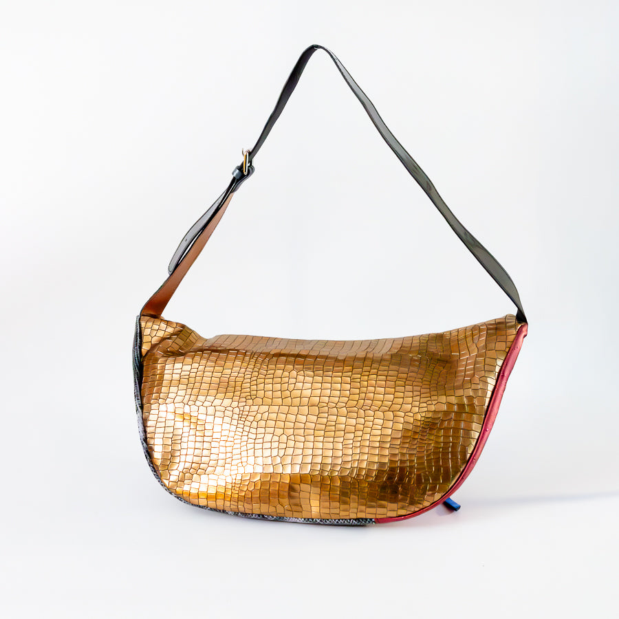 Back view of Madeline crossbody bag in Capri Nights featuring gold Italian leather and adjustable strap