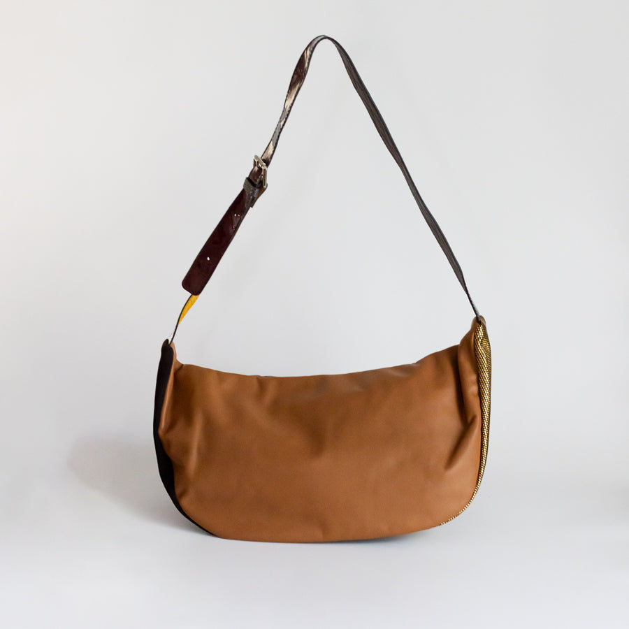 Back view of Madeline crossbody bag in Noir Jardin featuring brown Italian leather and adjustable strap