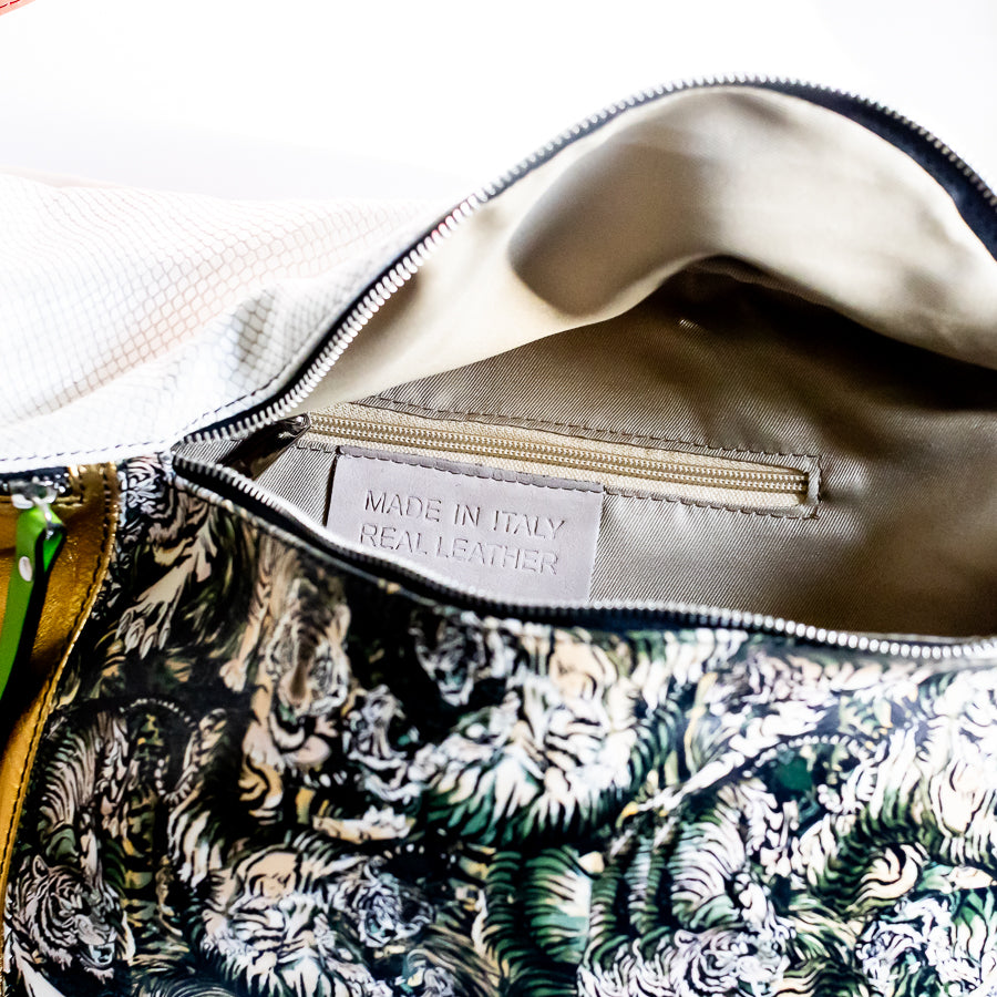 Interior image of Madeline crossbody bag in Bengal featuring interior zipped pocket and made in Italy real leather tag