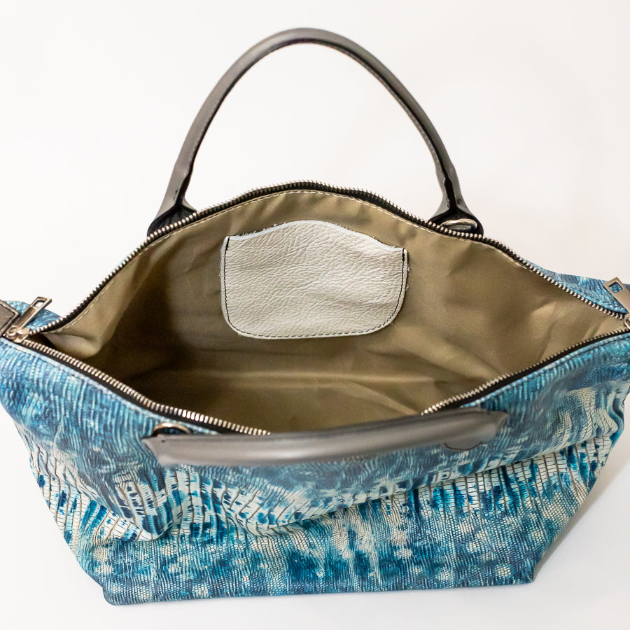 Interior image of Vera handbag in Amalfi Coast featuring interior pocket and gold zipper hardware