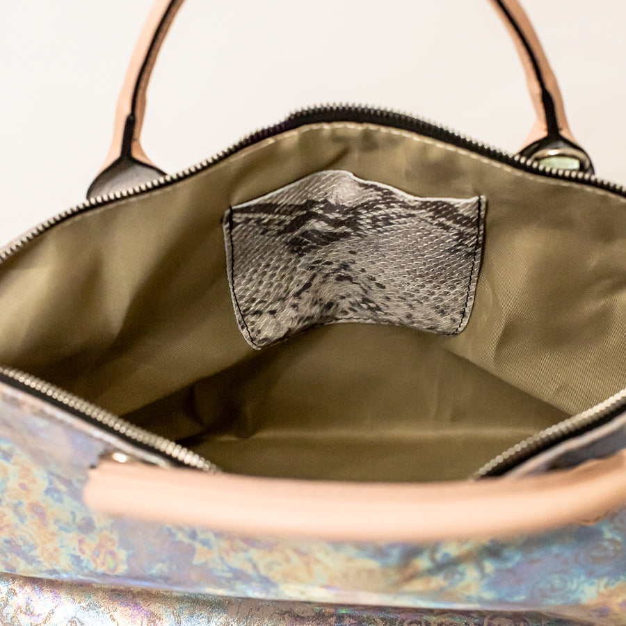 Interior image of Vera handbag in Opaline Garden featuring snakeskin Italian leather interior pocket and zippered opening