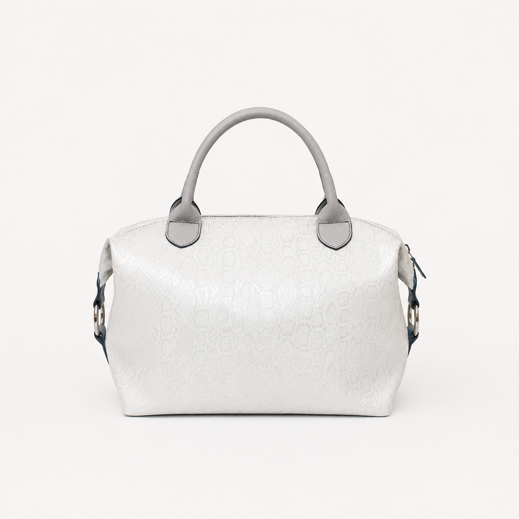 Vera handbag in Winter Lace featuring side straps with silver o-ring clasp and top silver handles 